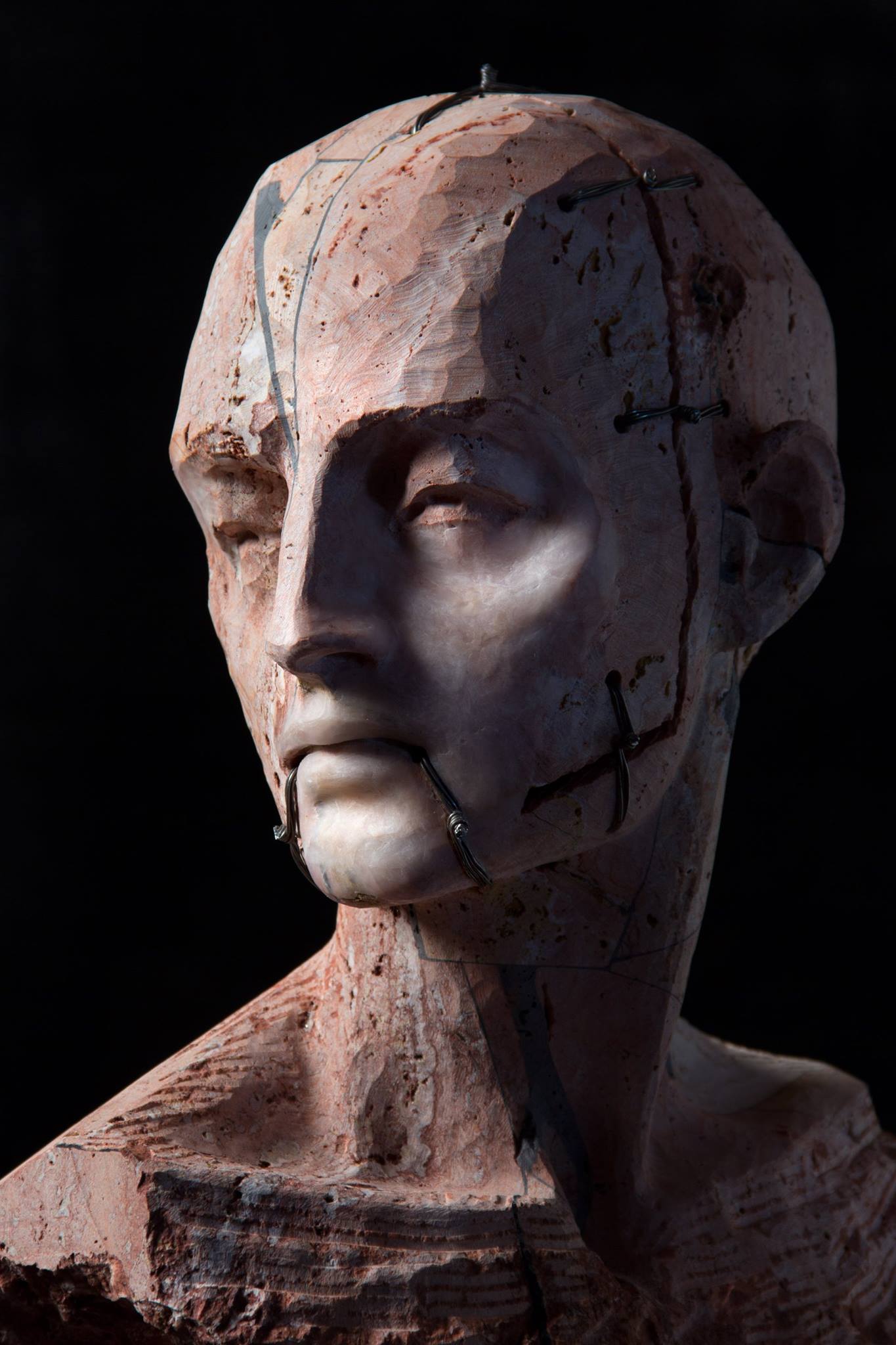 Christian Zucconi sculptures – Testa III (2014). Stone, iron and wax, cm 30 x 20,5 x 41