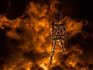 A Lion Of Fire Pouncing On The Man ©DUNCAN RAWLINSON