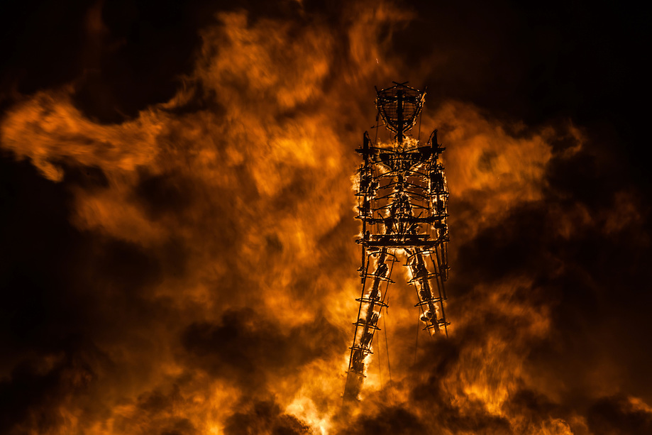 A Lion Of Fire Pouncing On The Man ©DUNCAN RAWLINSON