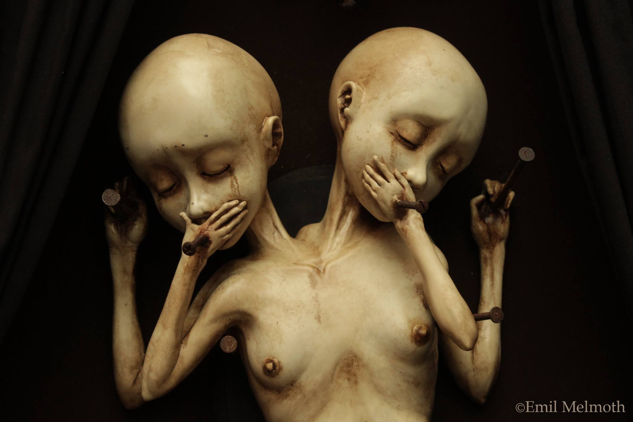 Emil Melmoth, Sculptures – A closer look of « Arcane », the twin sisters that are the main attraction of a wicked and morbid sight, the urging desire of the pedophile mind disguise as one of a gentleman