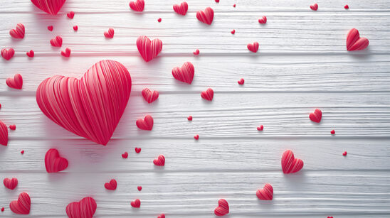 Valentine candy hearts isolated on a white wood background
