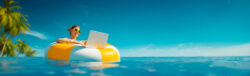 Young worker on a large white and yellow inflatable buoy